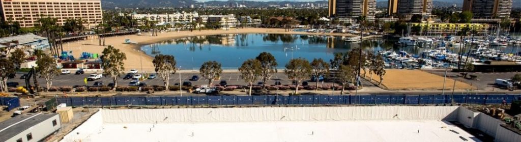 Foreground of building and lakeside in Marina Del Rey in background